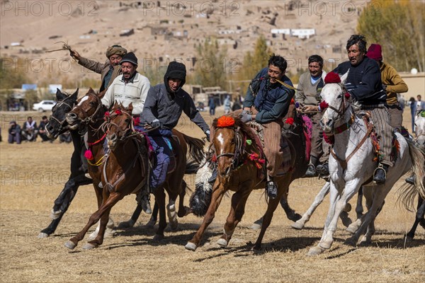 Men practising a traditional Buzkashi game