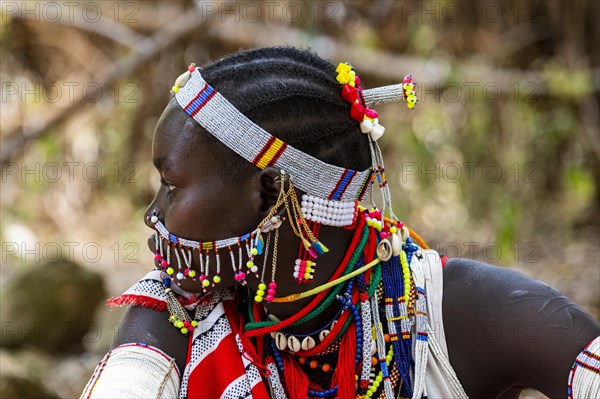 Traditional dressed young girl from the Laarim tribe