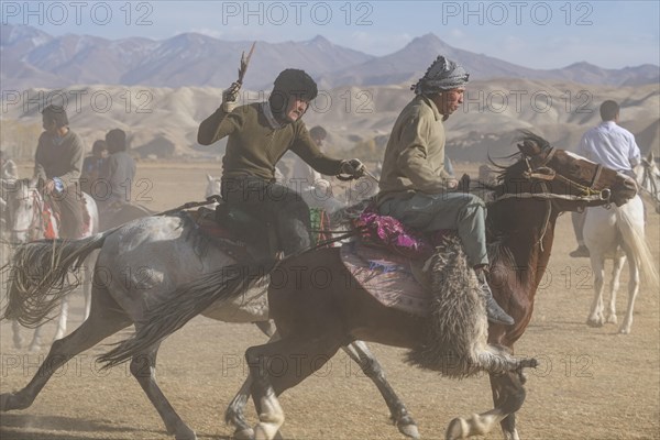 Men practising a traditional Buzkashi game