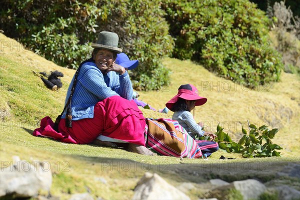 Old indigenous woman and granddaughter