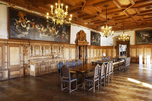 Dining room with wood panelling and coffered ceiling