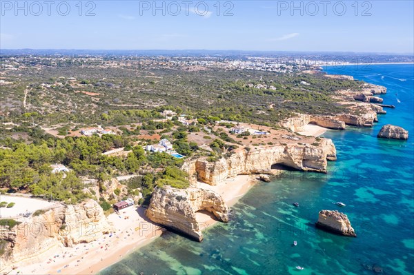 Portugal Algarve beach Praia da Marinha sea ocean drone shot from above in Praia da Marinha