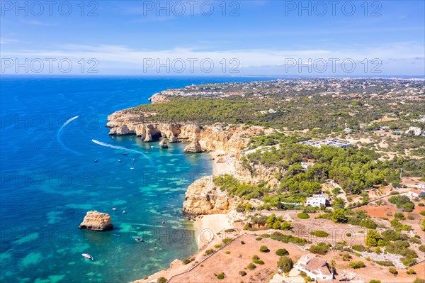 Portugal Algarve beach Praia da Marinha sea ocean drone shot from above in Praia da Marinha