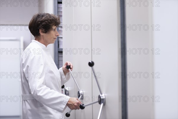 Technician working in a laboratory archive