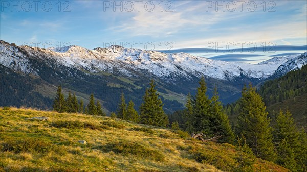 Autumnal mountain landscape with spruces