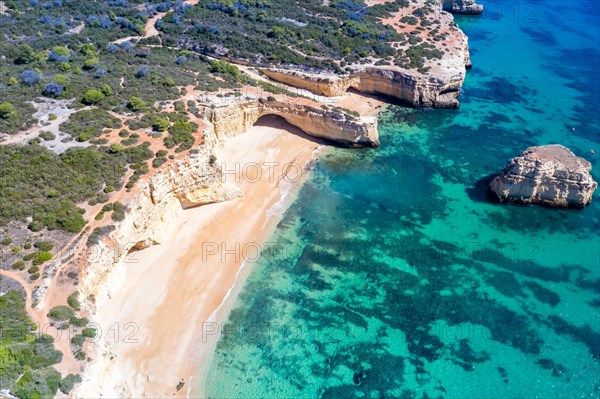 Portugal Algarve beach Praia da Marinha sea ocean drone shot from above in Praia da Marinha