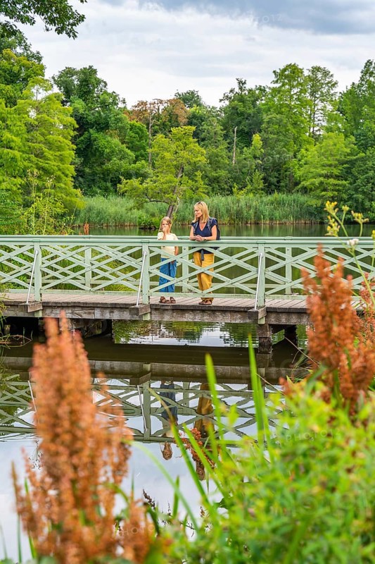 Woman and girl on a bridge over the machine pond - Photo12-imageBROKER ...