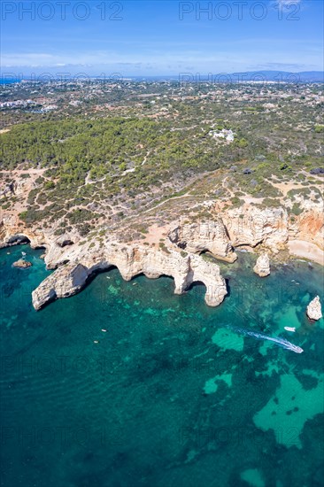 Portugal Algarve beach Praia da Marinha sea ocean drone shot from above in Praia da Marinha