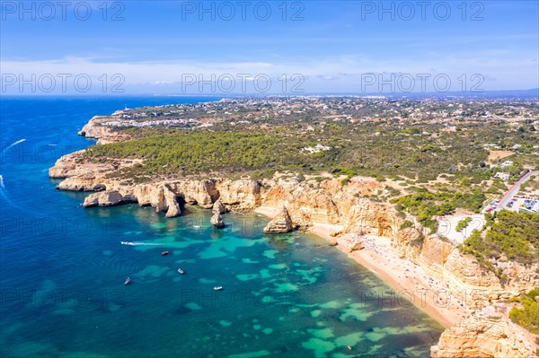 Portugal Algarve beach Praia da Marinha sea ocean drone shot from above in Praia da Marinha