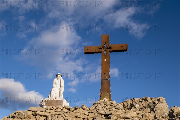 Summit cross and Jesus figure on Monte Castellaz