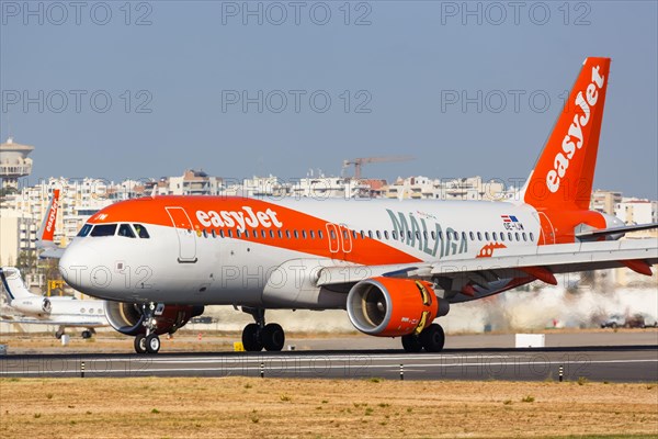 An EasyJet Airbus A320 with registration OE-IJW at Faro Airport