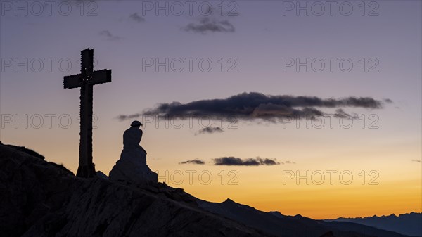 Summit cross and Jesus figure on Monte Castellaz