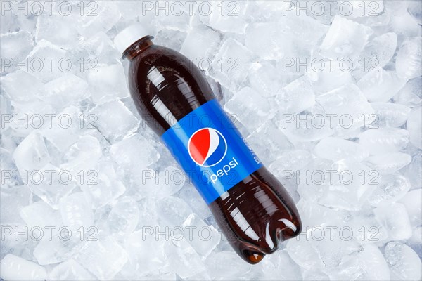 Pepsi Cola in plastic bottle lemonade soft drink drink on ice cube ice cubes