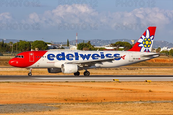 An Edelweiss Airbus A320 with registration HB-IHX at Faro Airport