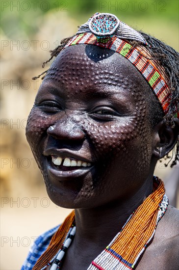 Woman with beauty scars from the Toposa tribe