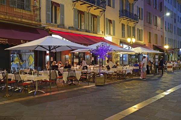 Evening hustle and bustle with restaurants and market stalls on the Cours Saleya