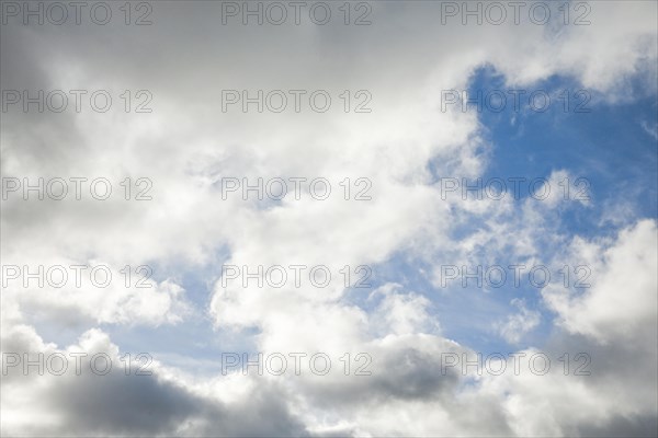 Stratocumulus clouds and blue sky windows form spectacular cloud formation in the sky during Foehn storm