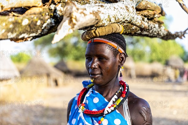 Woman carrying firewood on her head