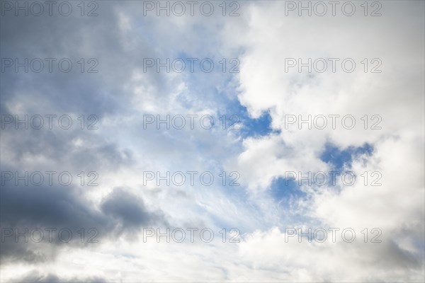 Stratocumulus clouds and blue sky windows form spectacular cloud formation in the sky during Foehn storm