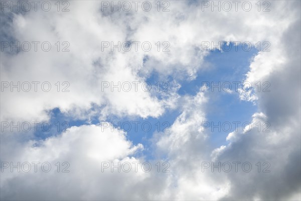 Stratocumulus clouds and blue sky windows form spectacular cloud formation in the sky during Foehn storm