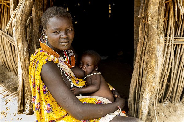 Woman from the Toposa tribe breastfeeding her baby