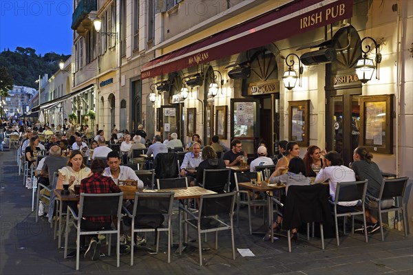 Evening hustle and bustle with restaurants and market stalls on the Cours Saleya