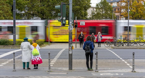 Pedestrians and vehicles at a traffic light