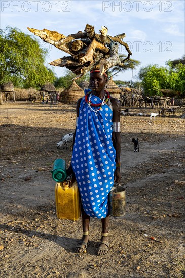 Woman carrying firewood on her head