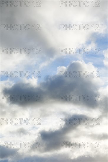 Stratocumulus clouds and blue sky windows form spectacular cloud formation in the sky during Foehn storm