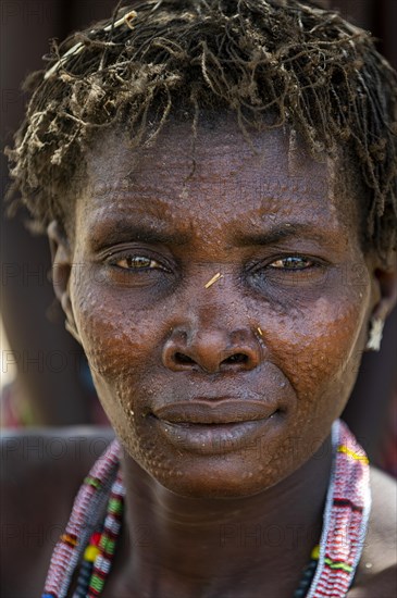 Woman with beauty scars from the Toposa tribe