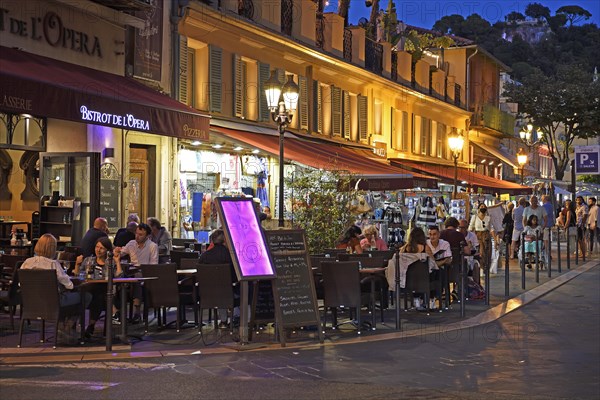 Evening hustle and bustle with restaurants and market stalls on the Cours Saleya