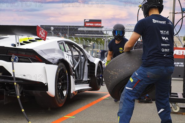 Pit crew practising wheel change and refuelling on the Lamborgini Huracan GT3 Evo DTM race car of German Touring Car driver Esteban Muth at Norisring city circuit