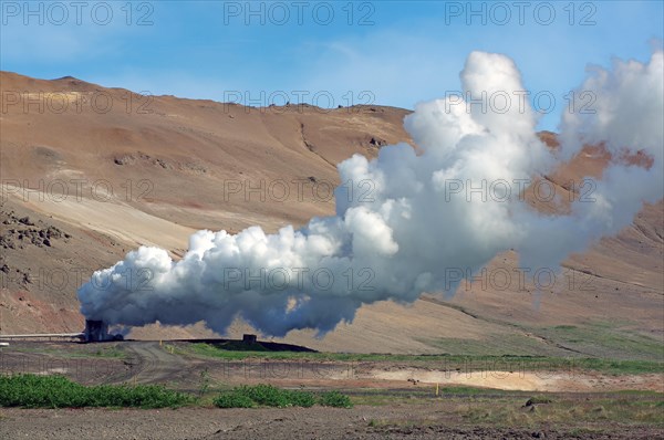 Plumes of steam hiss from a pipe