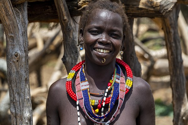 Friendly traditional dressed girl from the Toposa tribe