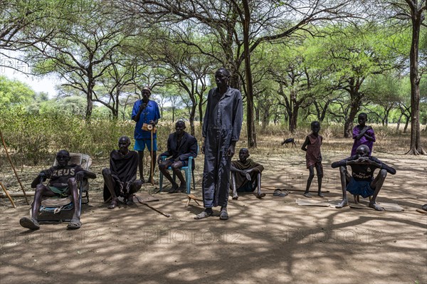 Olders of the Toposa tribe have a reunion under the trees