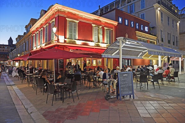 Evening hustle and bustle with restaurants and market stalls on the Cours Saleya