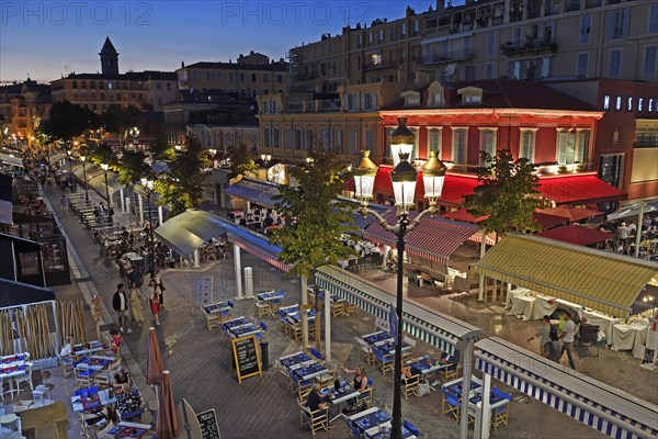 Evening hustle and bustle with restaurants and market stalls on the Cours Saleya