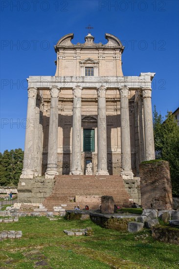 Historic facade of Temple of Pius and Faustina with staircase and ancient columns