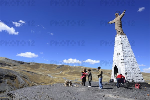 Ceremony with a shaman at the statue of Jesus at La Cumbre Pass