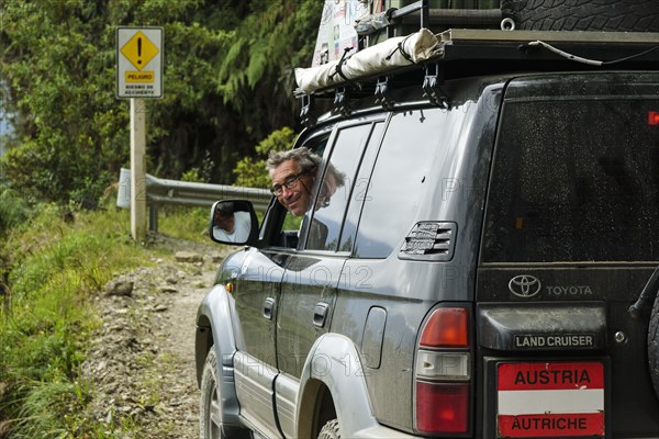 Driver smiling from an off-road vehicle