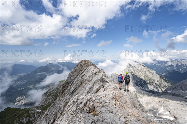 Young couple standing together at the summit after a hike