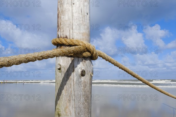 Wooden pole with rope for demarcating the bathing area