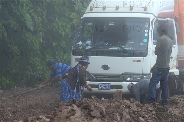 Truck stuck in mud on Ruta 3 in fog