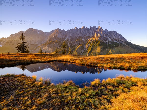 Mandlwaende and Hochkoenig at sunset reflected in a mountain lake