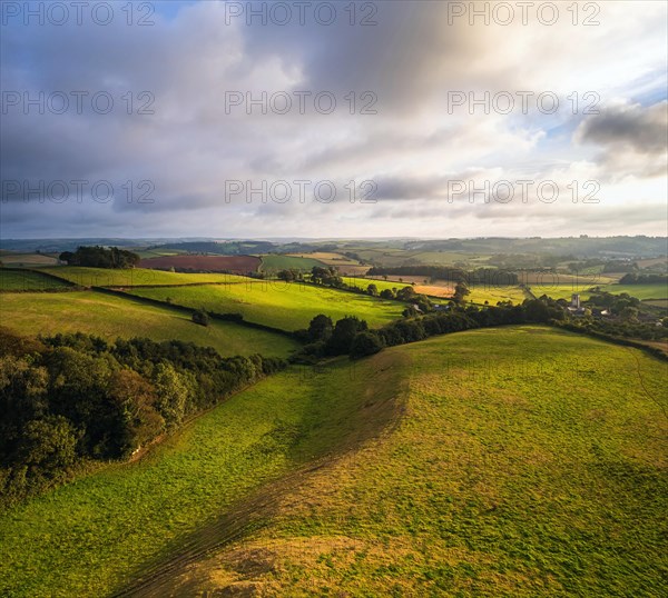 Fields and Meadows over English Village from a drone