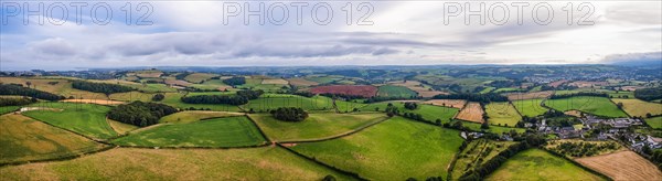 Panorama of Fields and Meadows over English Village from a drone