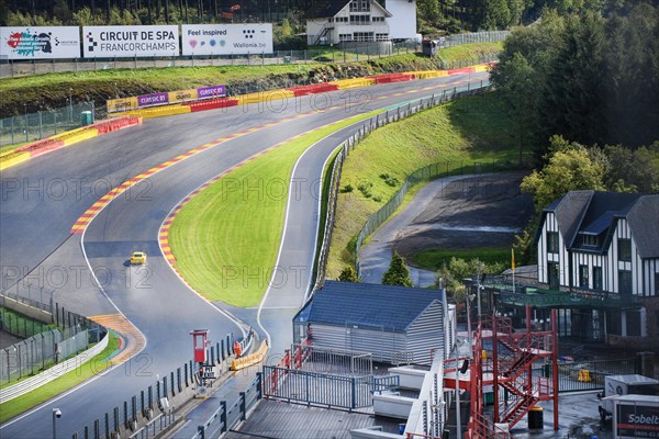 View of Porsche Cayman GT4 in curve Eau Rouge