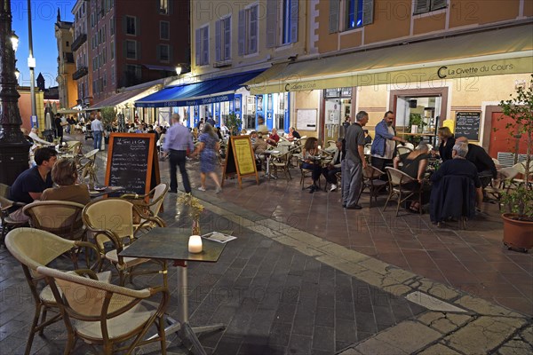 Evening hustle and bustle with restaurants and market stalls on the Cours Saleya