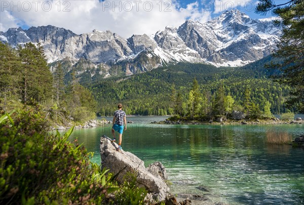 Young man standing on a rock