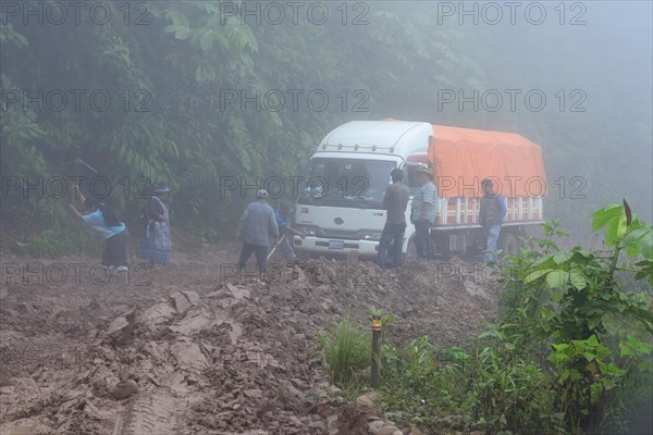 Truck stuck in mud on Ruta 3 in fog